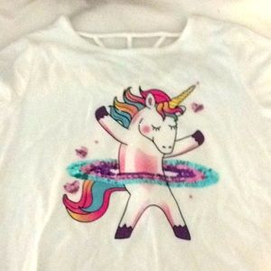 A tee shirt with a beautiful shiny unicorn.